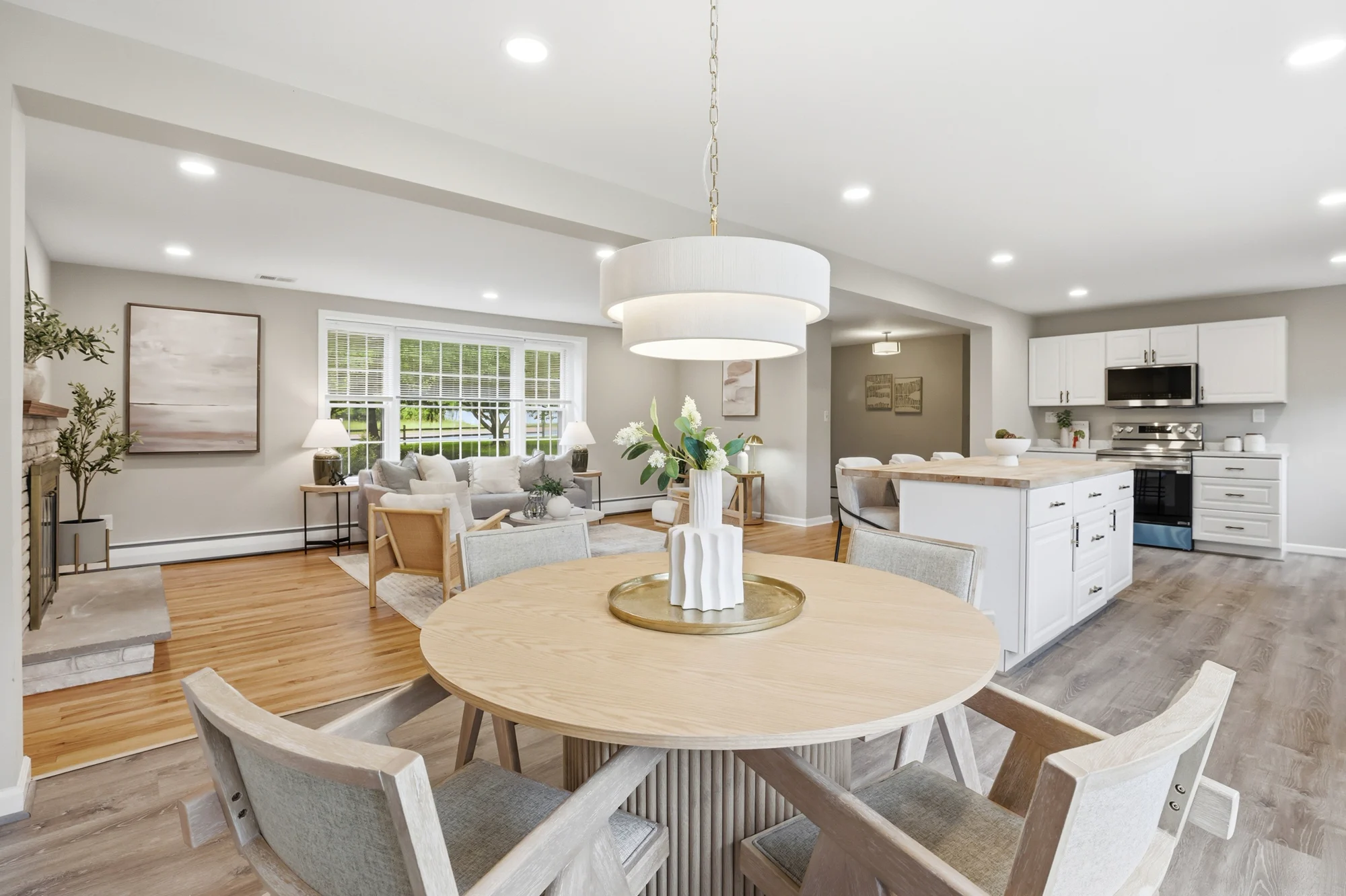 House of Benenate staging project with an open living, dining, and kitchen space