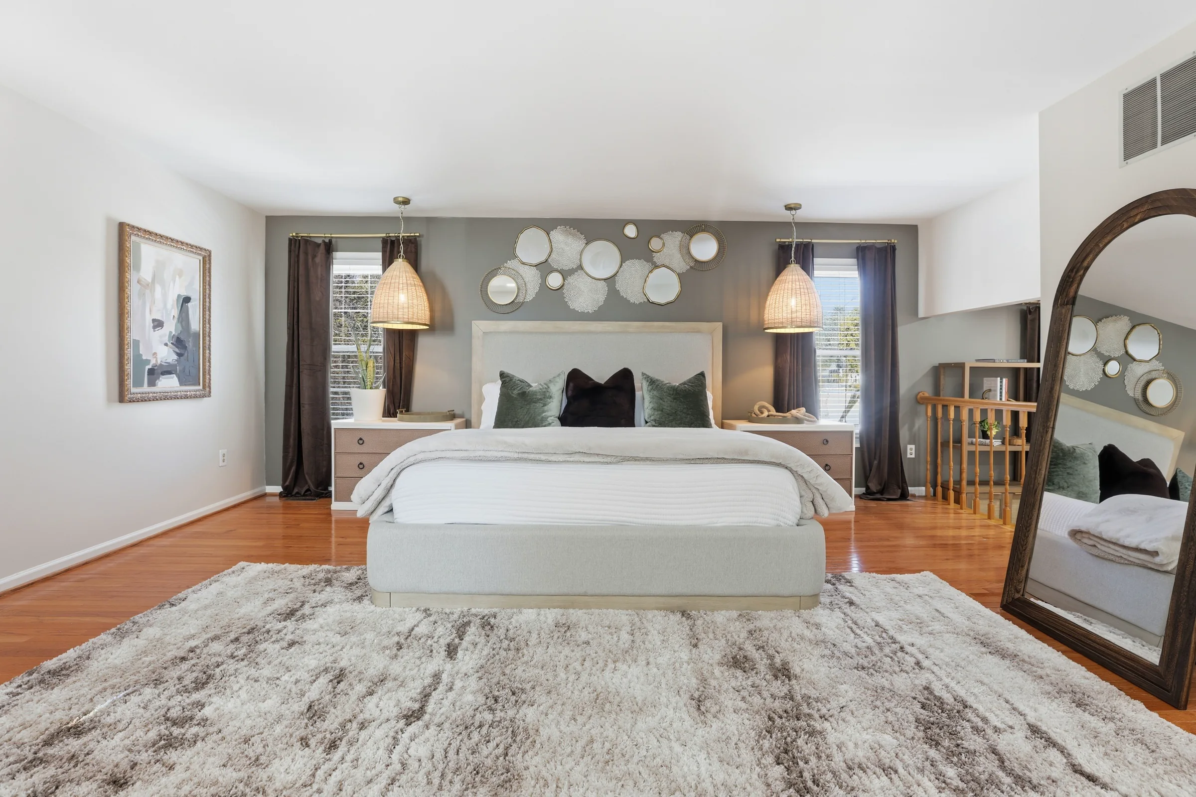 House of Benenate bedroom design with layered neutrals, statement lighting, and a curated mirror wall
